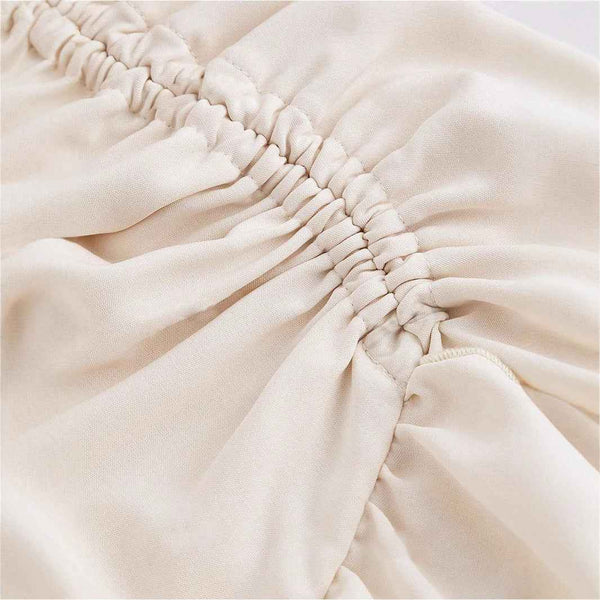 Falda de cintura alta asimétrica con dobladillo de hoja de loto atado.